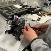 hands working on equipment