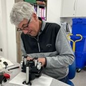 Paul working on dental laboratory and surgery equipment